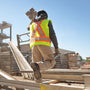 Wearing safety shoes to avoid workplace related injuries.